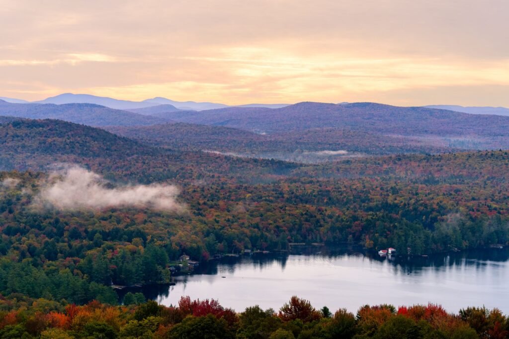 Autumn colour over a lake in the Adirondacks, upstate New York
