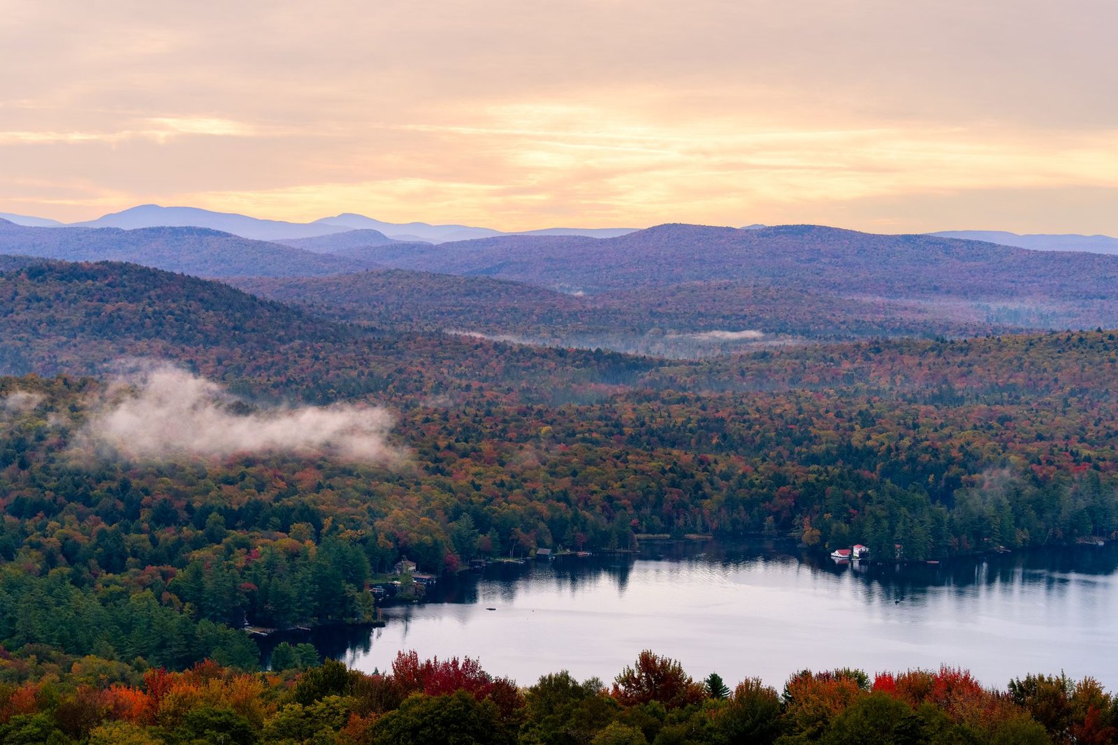 Autumn colour over a lake in the Adirondacks, upstate New York