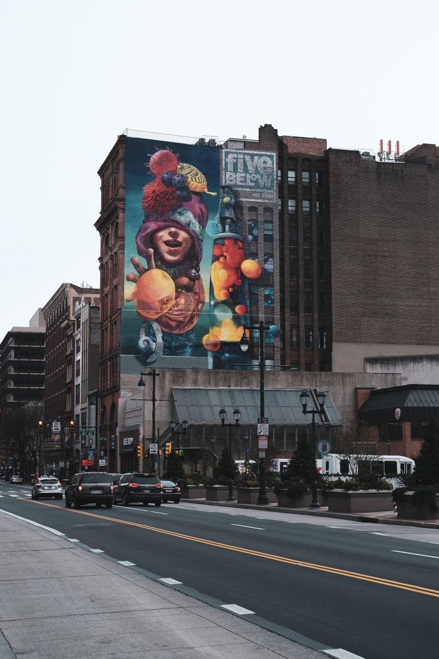 A large painted mural on a building wall in Philadelphia