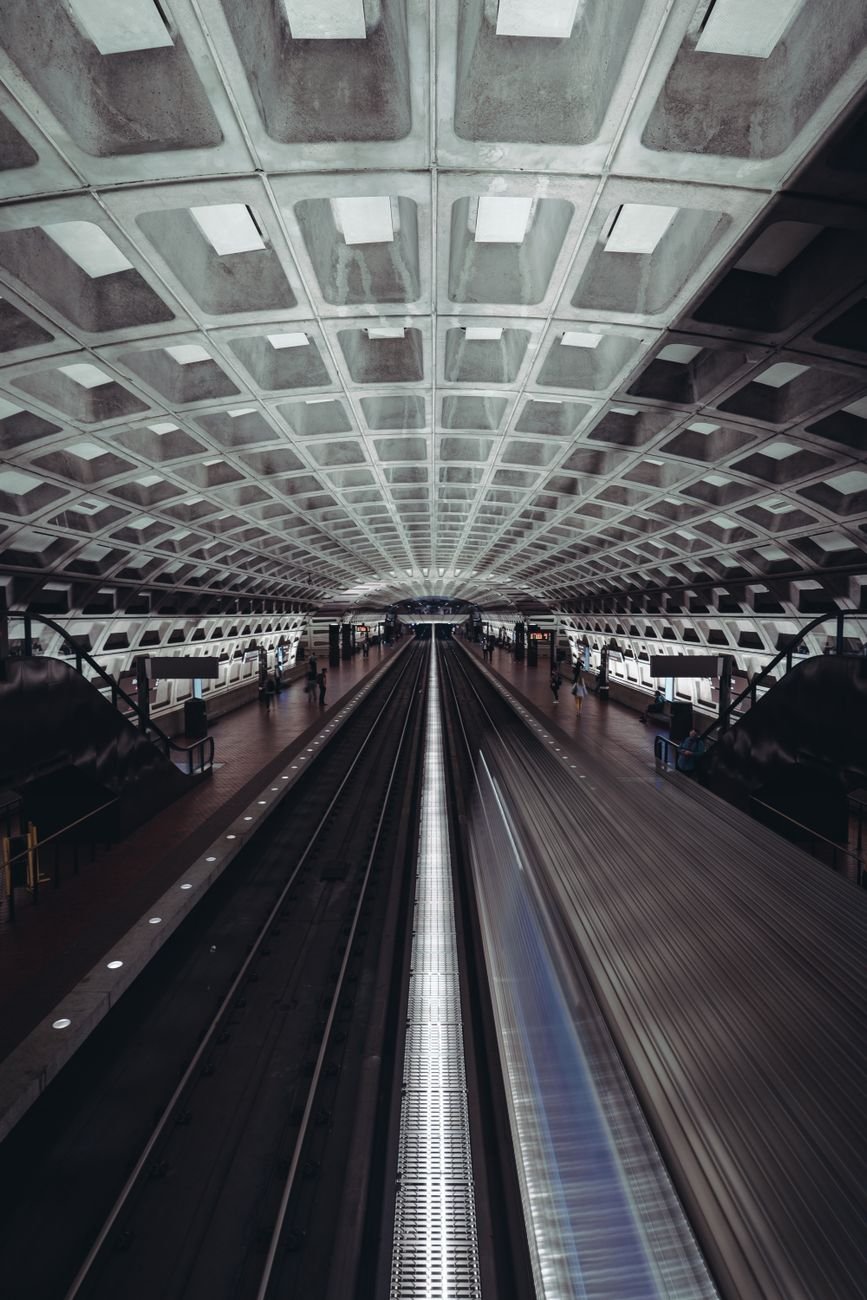 The vaulted concrete ceiling of a Washington Metro station
