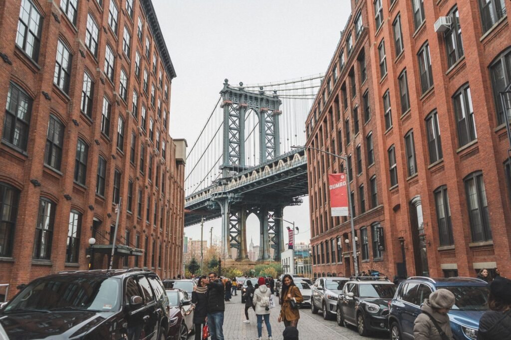 The Manhattan Bridge framed by brick warehouses on Washington Street in DUMBO, Brooklyn