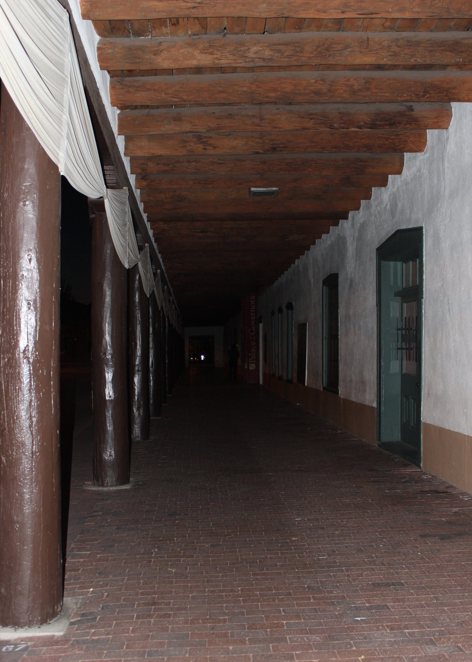 The long wooden portal of the Palace of the Governors on the Santa Fe Plaza