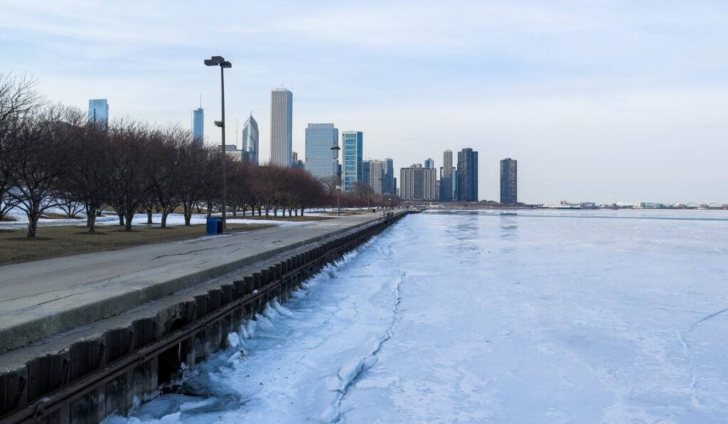 The Chicago skyline above a frozen Lake Michigan shoreline in winter