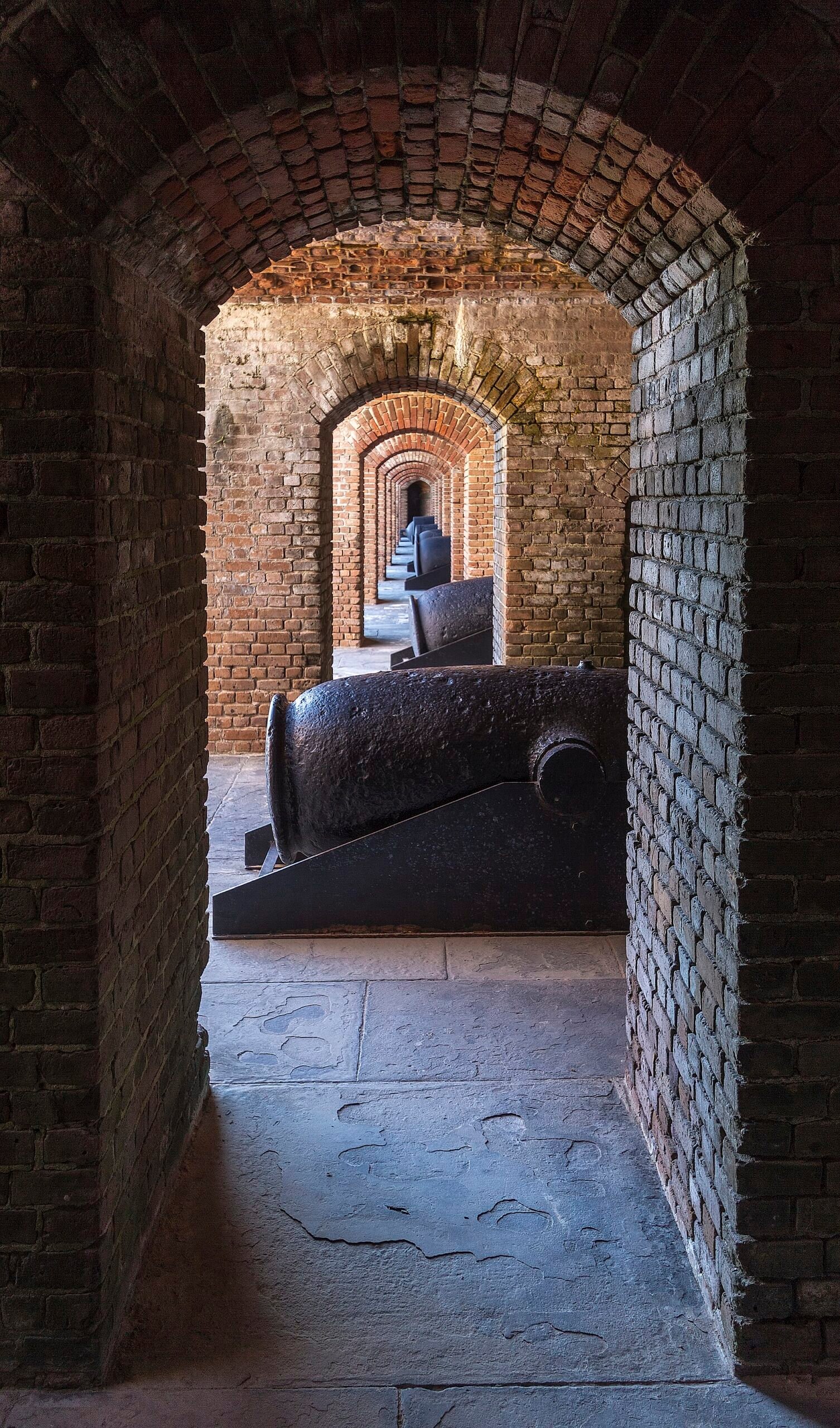 Brick archways and a cannon inside Fort Zachary Taylor in Key West