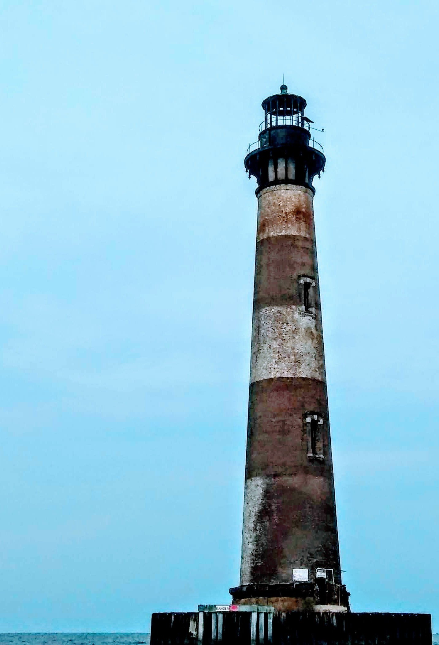 Morris Island Lighthouse standing in the surf off Folly Beach