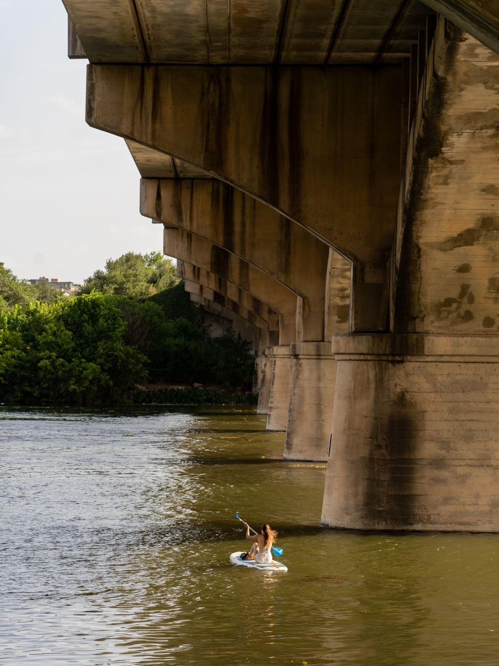 Kayakers and paddleboarders on Lady Bird Lake in Austin