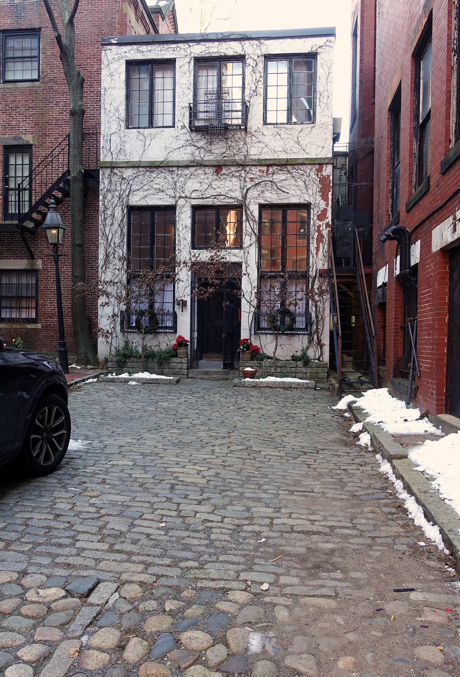 A cobbled lane of old brick houses on Beacon Hill in Boston