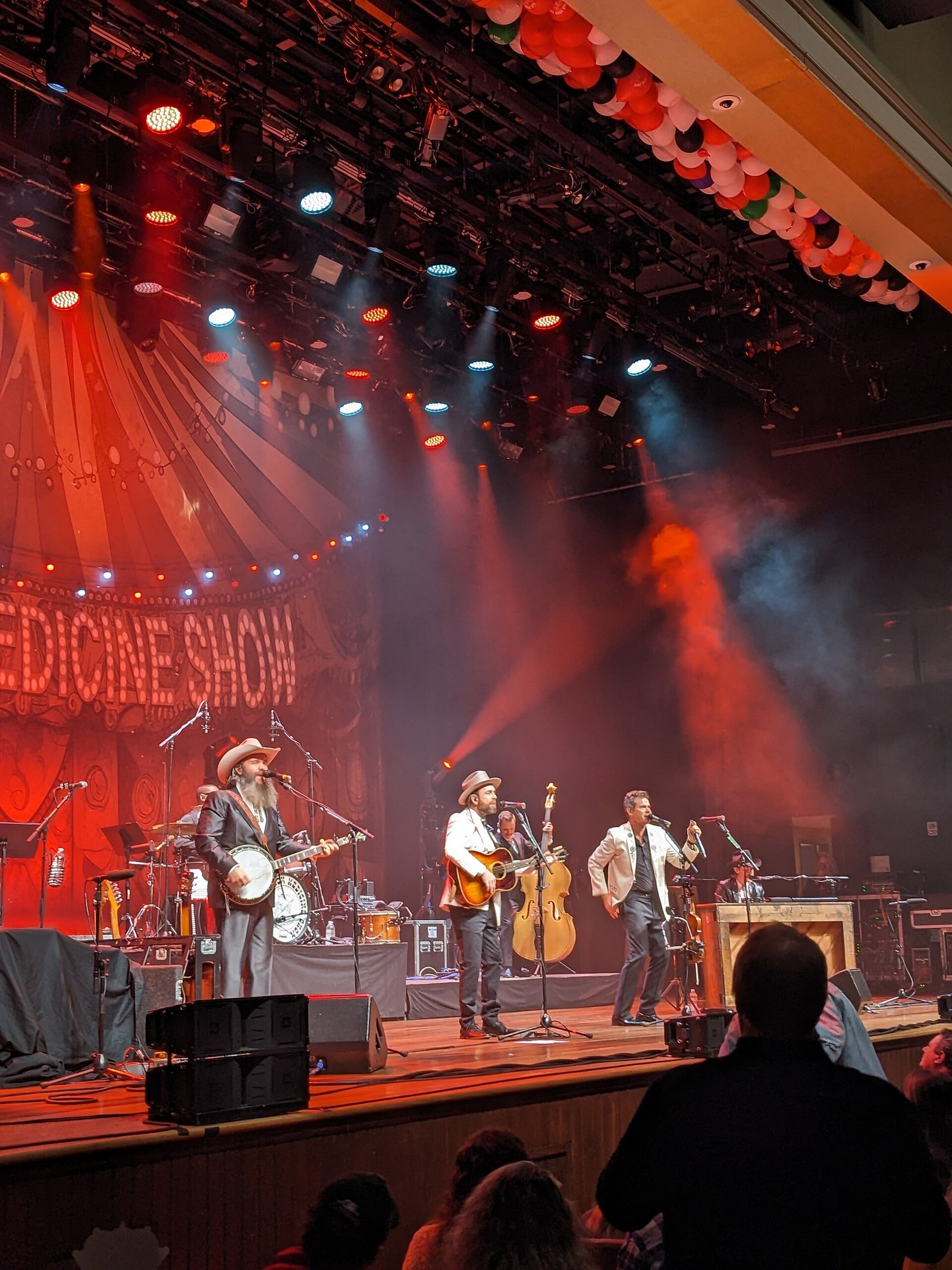 A concert on the stage of the Ryman Auditorium in Nashville