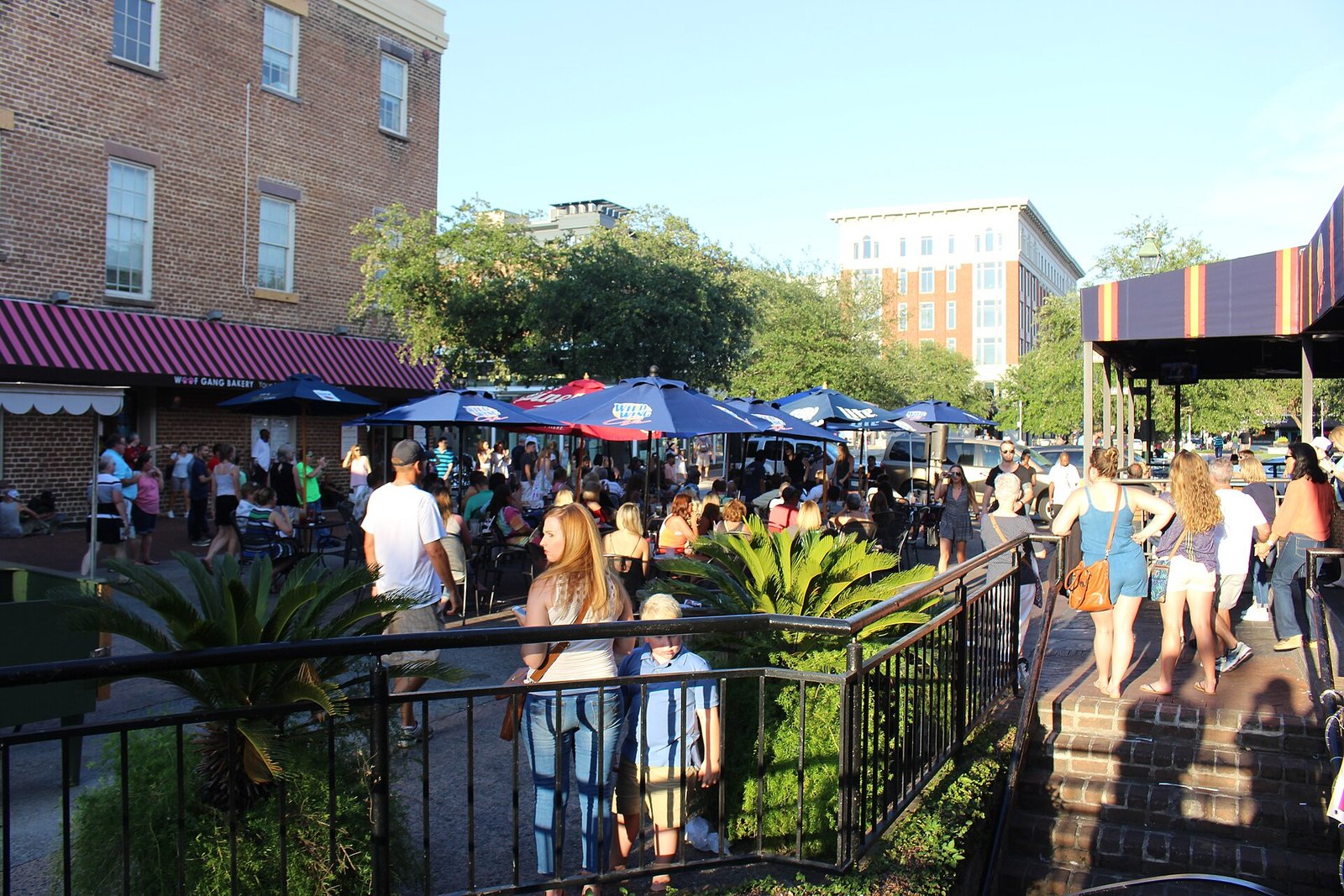 A crowd listening to live music in City Market, Savannah