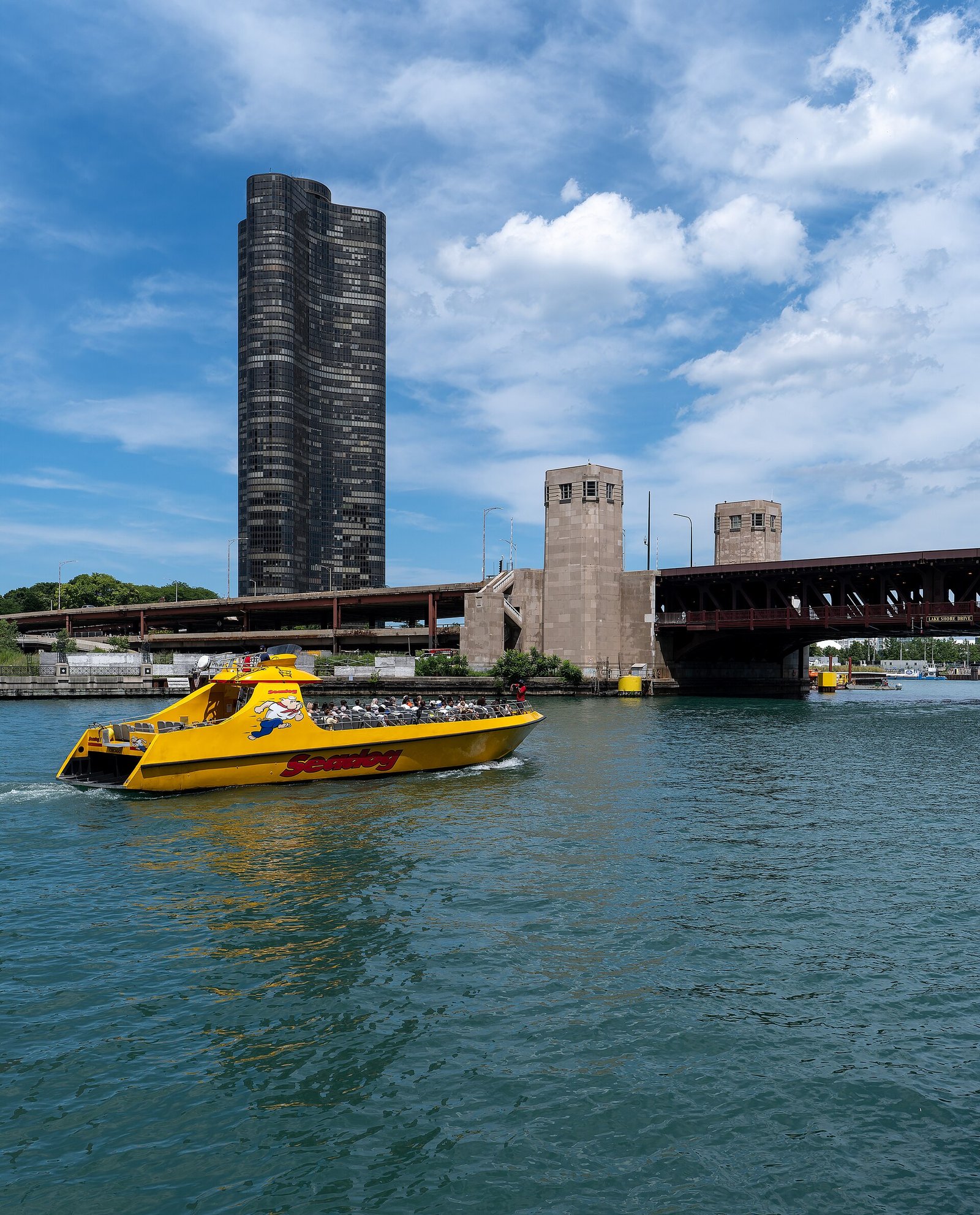 Tour boats on the Chicago River between downtown towers