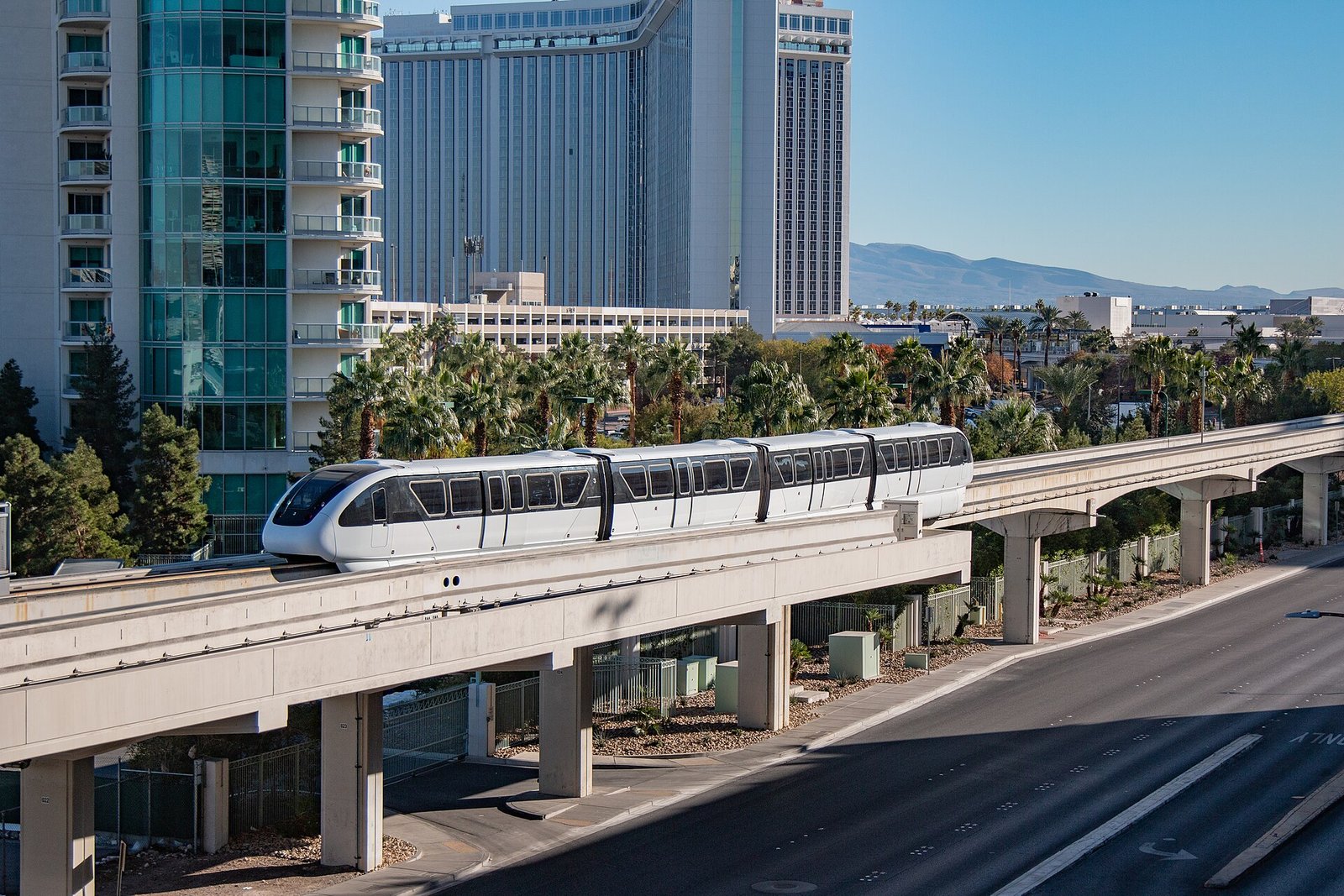 A Las Vegas Monorail train on its elevated track behind the Strip