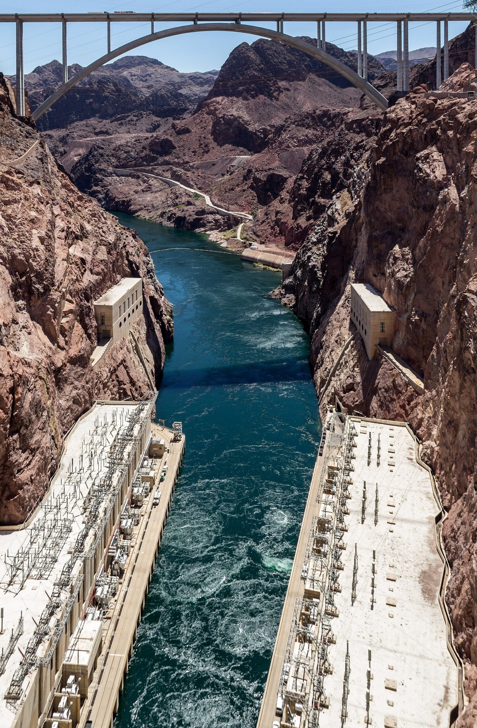 Looking down from Hoover Dam at its powerhouses and the Colorado River
