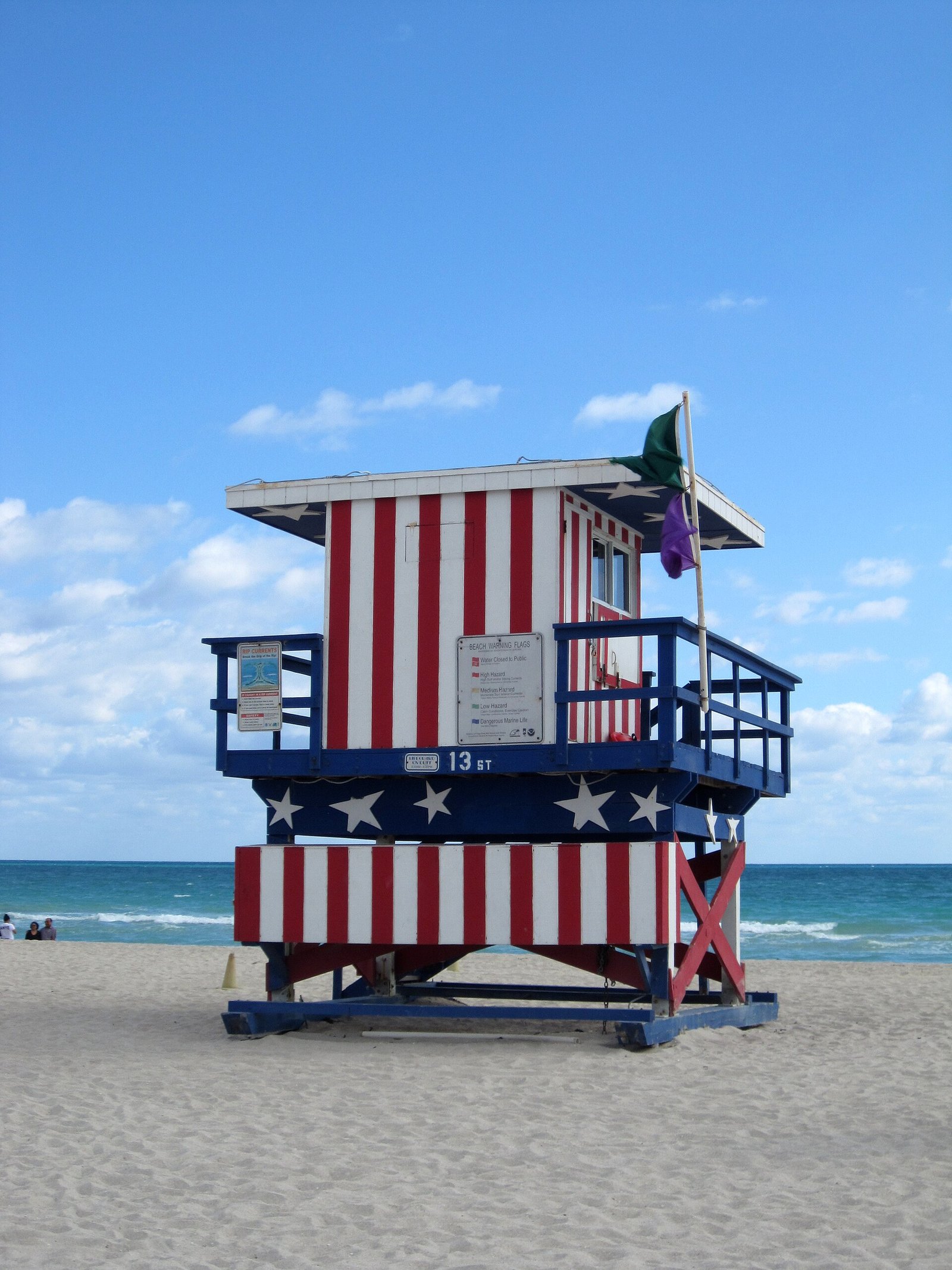 A colorful lifeguard tower on the sand at Miami Beach